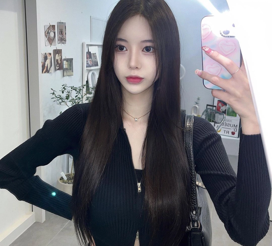 Selfie of a young girl with vline after Korean double chin removal surgery.