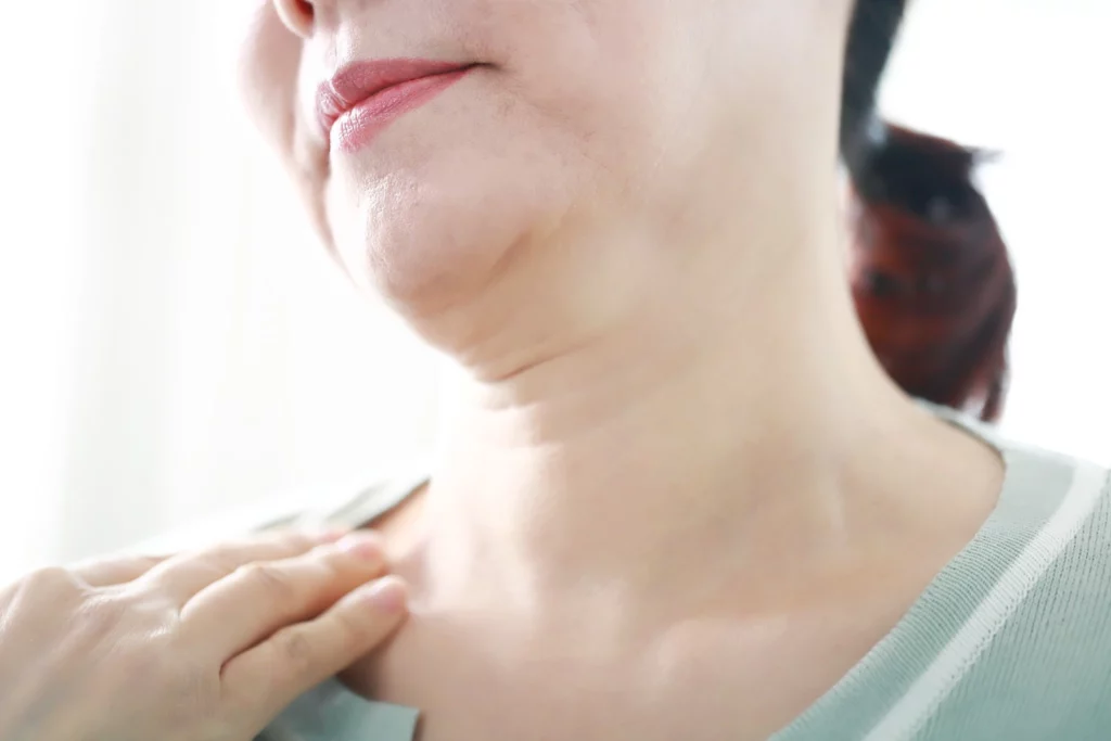Close-up of the neck area showing visible neck wrinkles and natural skin folds associated with aging.