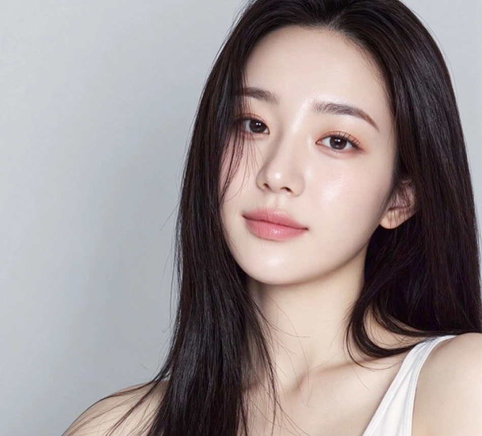 Young woman with a defined jawline and smooth facial contours after salivary gland removal.