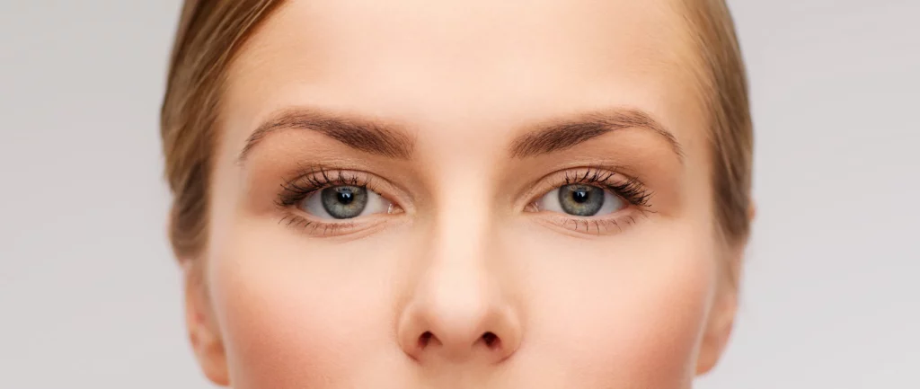 Woman with naturally lifted, well-defined brows after endoscopic forehead lift surgery at Mine Clinic, Seoul, Korea.