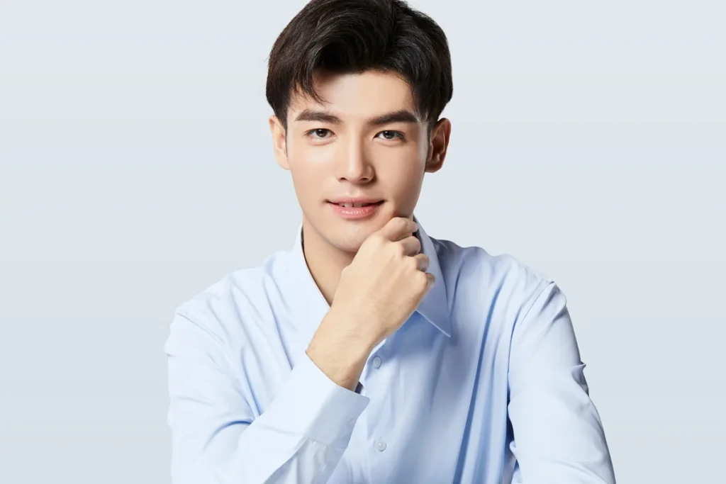 Ultherapy for men: male model resting his chin on his hand, showing the jawline