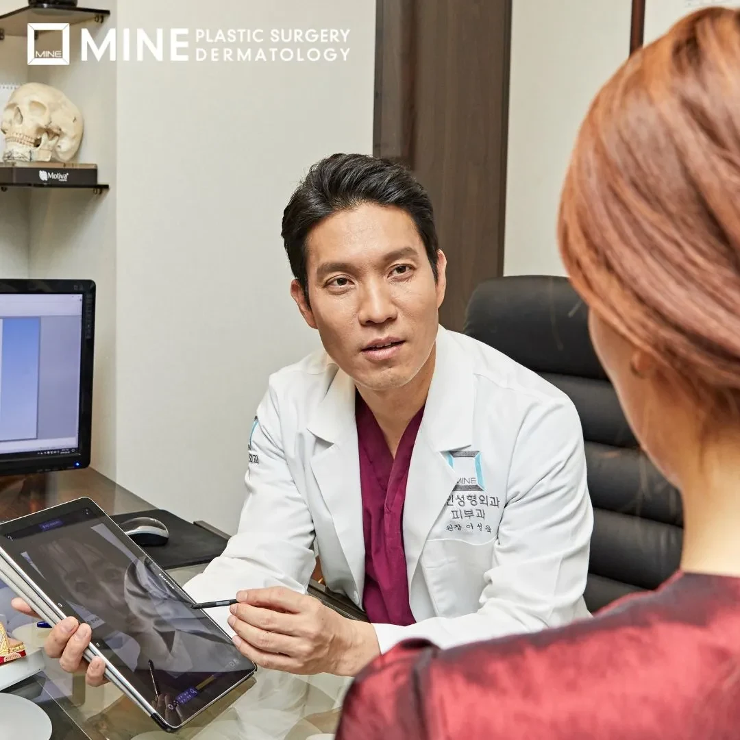 Doctor reviewing Ultherapy options on a tablet with a patient during a consultation at MINE Plastic Surgery in Seoul